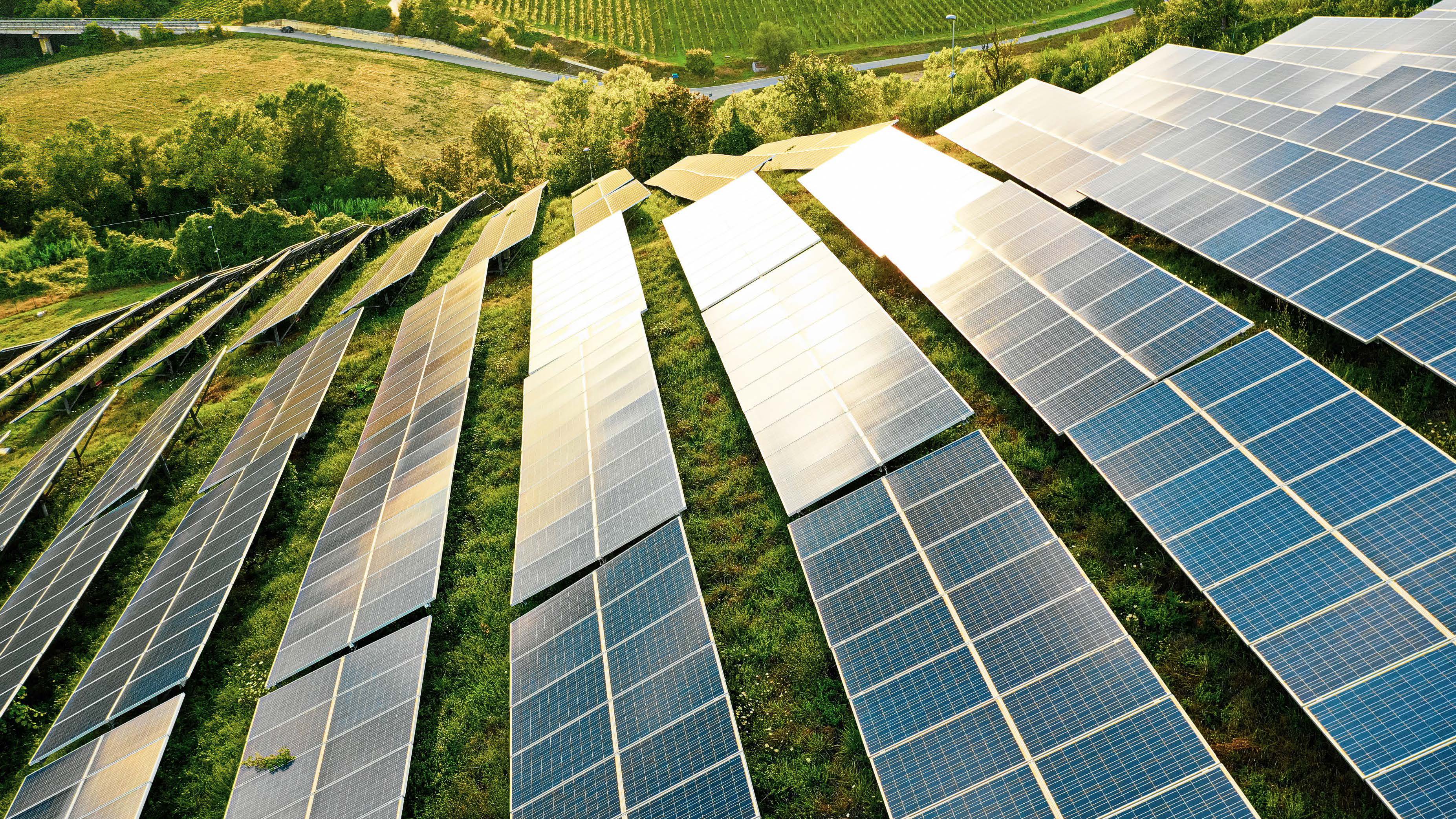 Solar panels fields on the green hills