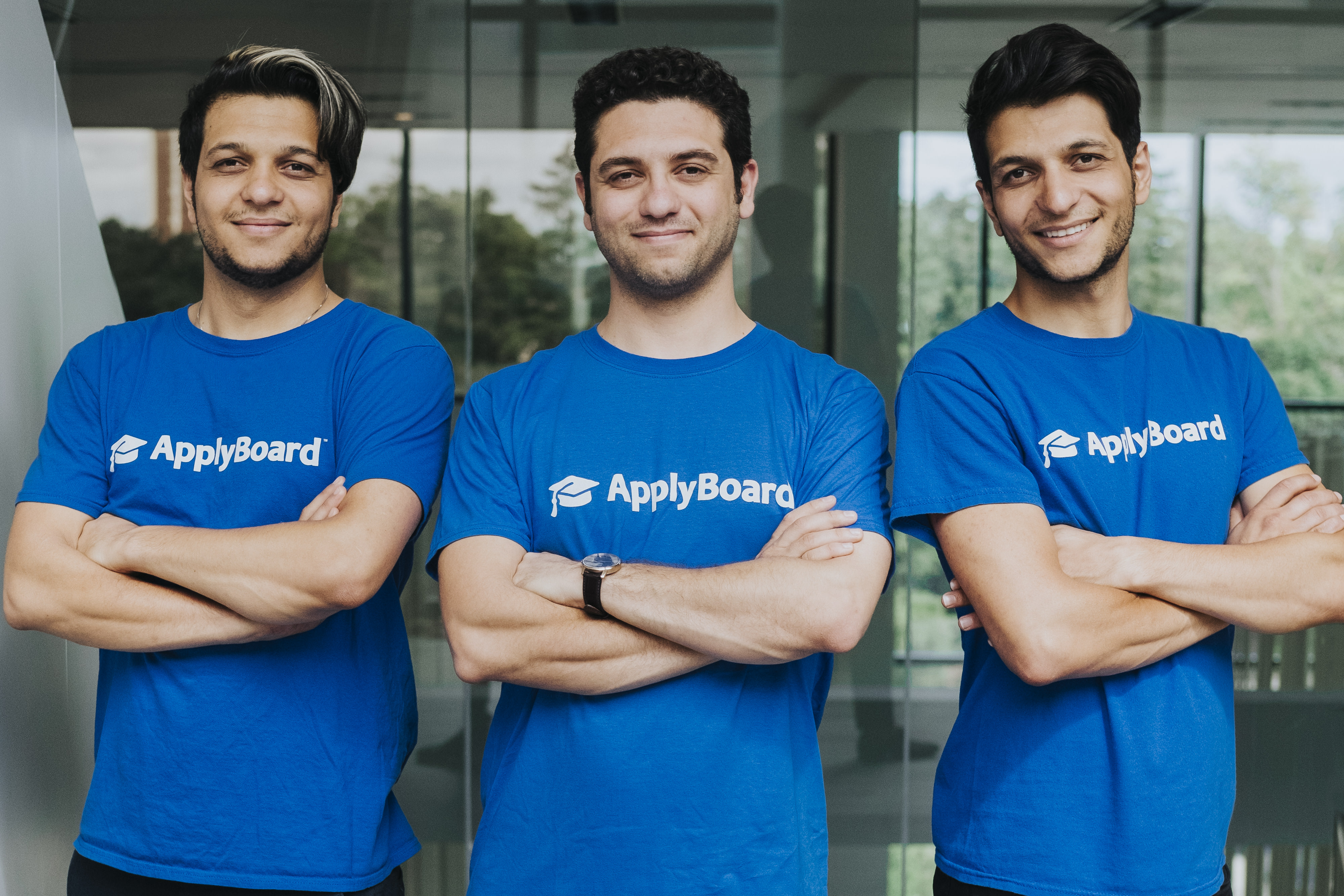 Three men wearing ApplyBoard shirts